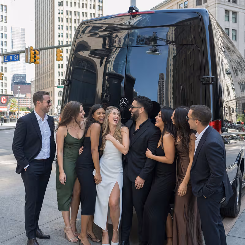 Group boarding a white charter bus for Bachelor & Bachelorette Transportation transportation in Cleveland