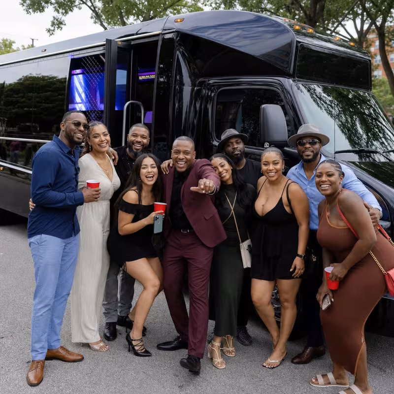 Group boarding a white charter bus for Birthday Transportation transportation in Cleveland