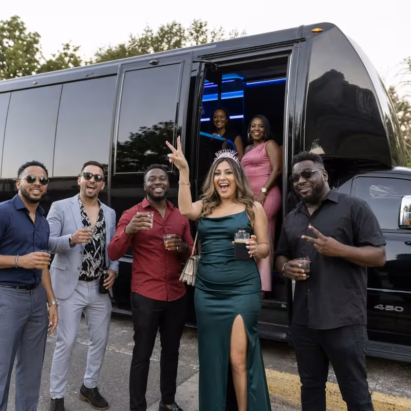 Party bus interior with wraparound leather seating and LED lighting in Cleveland