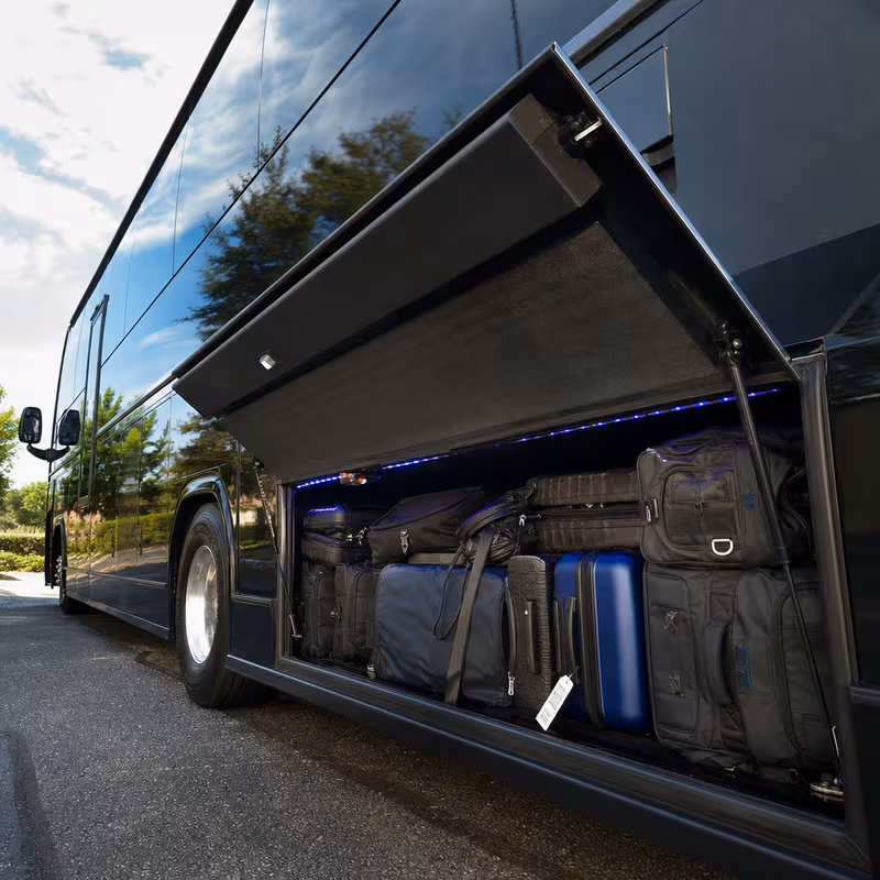 Party bus interior with wraparound leather seating and LED lighting in Cleveland