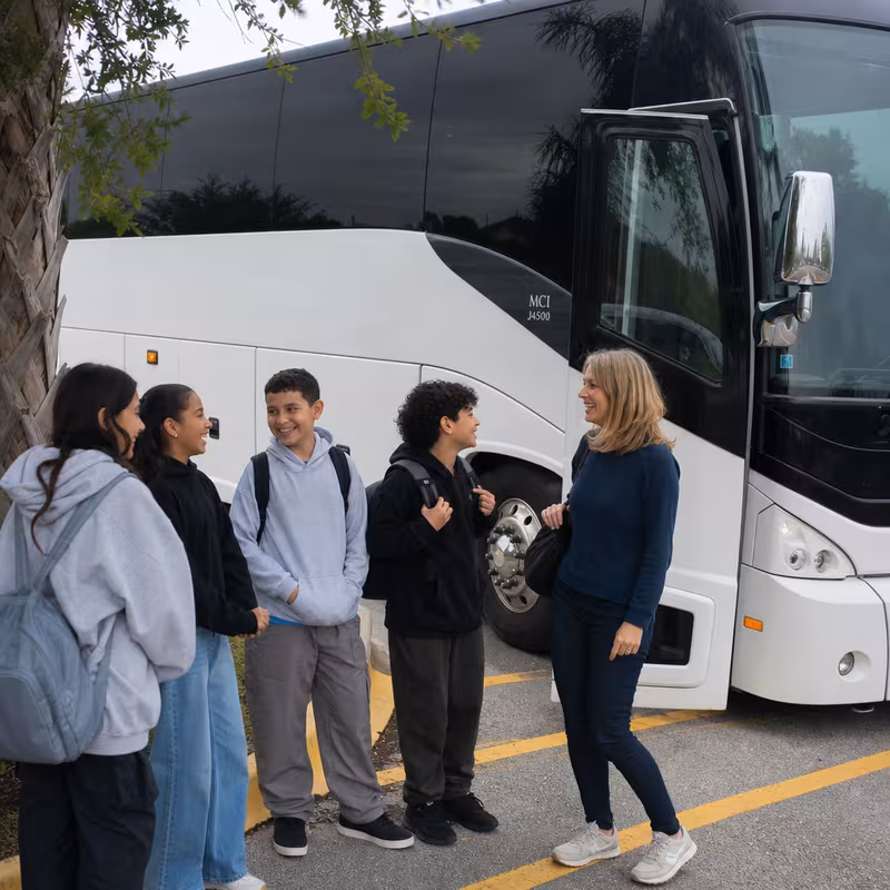 Passengers loading luggage while boarding an Cleveland group shuttle