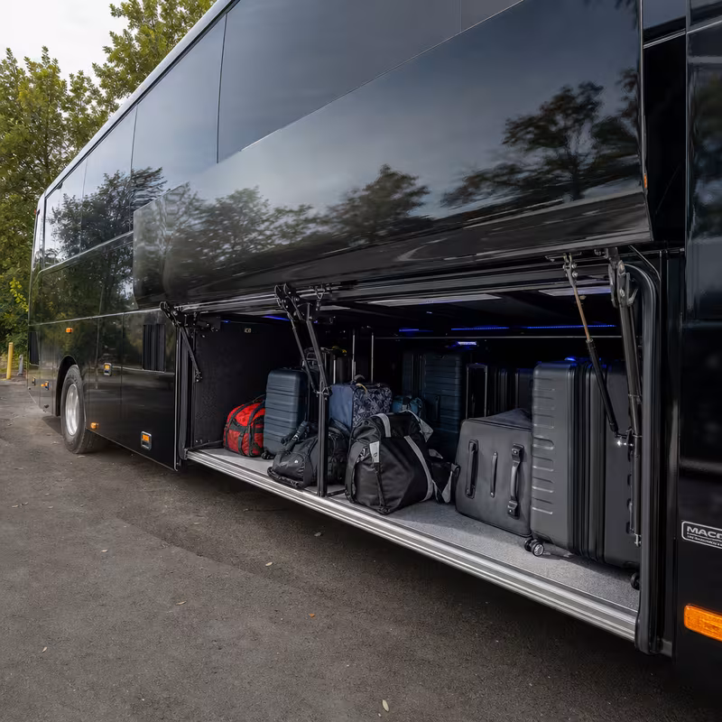 Party bus interior with wraparound leather seating and LED lighting in Cleveland