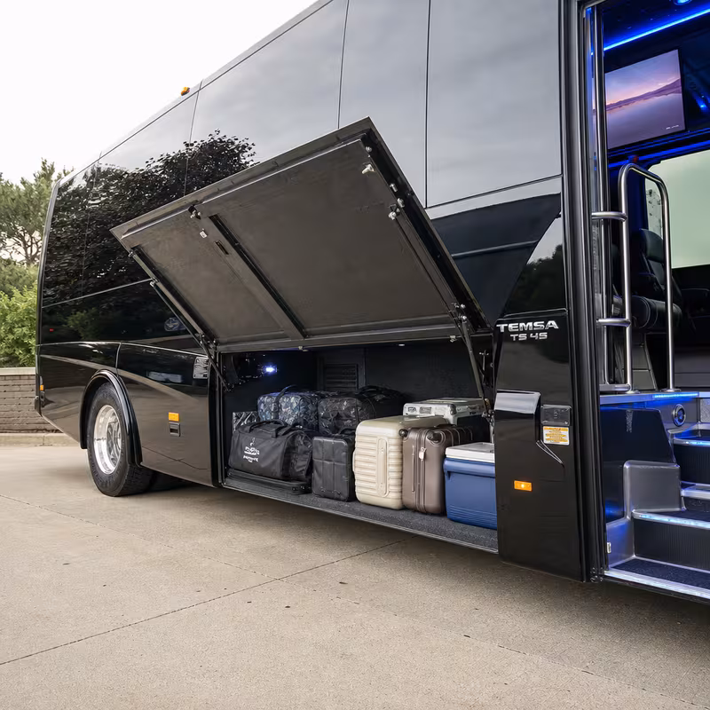 Party bus interior with wraparound leather seating and LED lighting in Cleveland