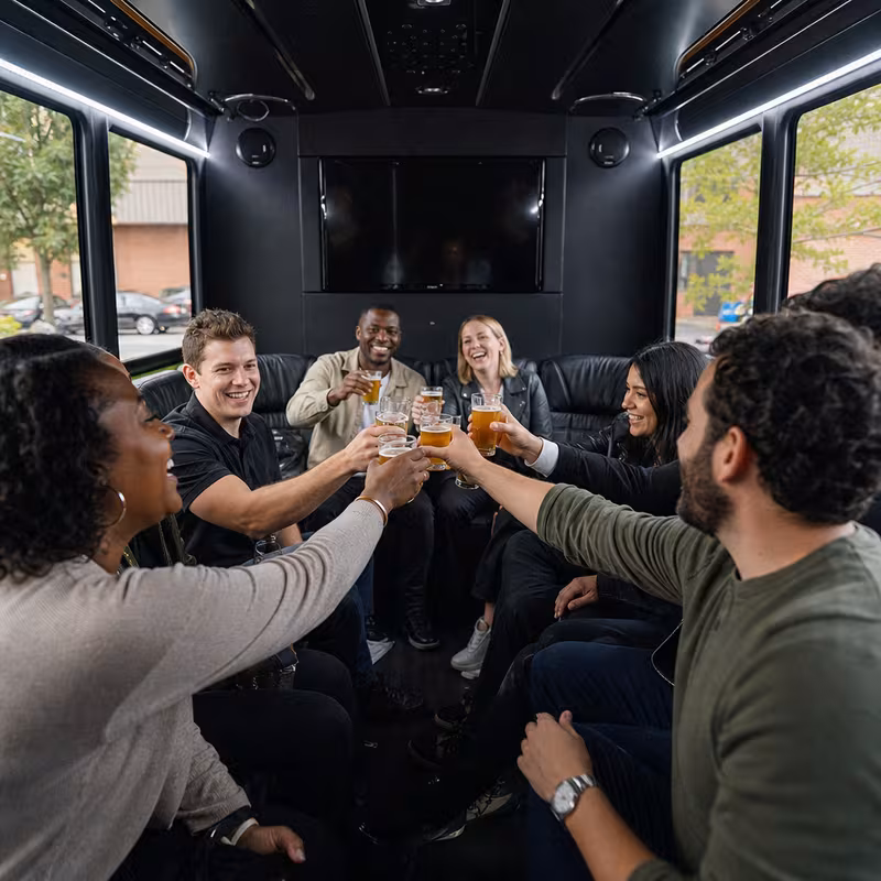 Group boarding a white charter bus for Winery & Brewery Tour Transportation transportation in Cleveland