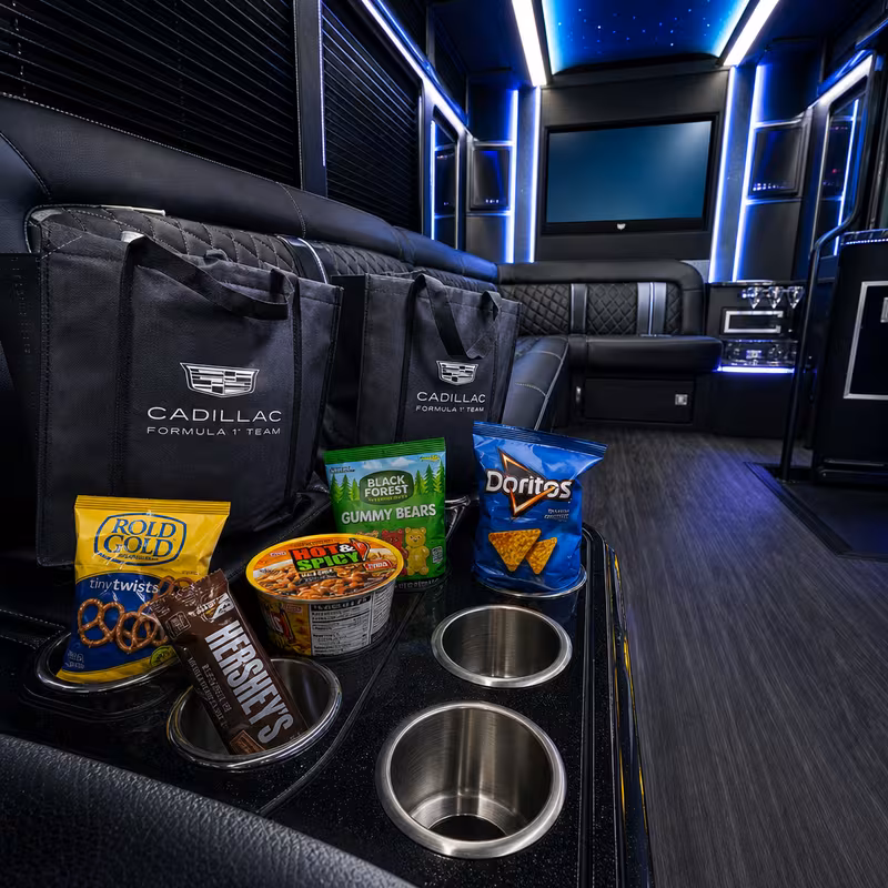 Party bus interior with wraparound leather seating and LED lighting in Cleveland